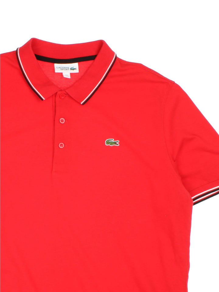 Vintage Lacoste Polo Shirt in a red colourway with the logo embroidered on the front.