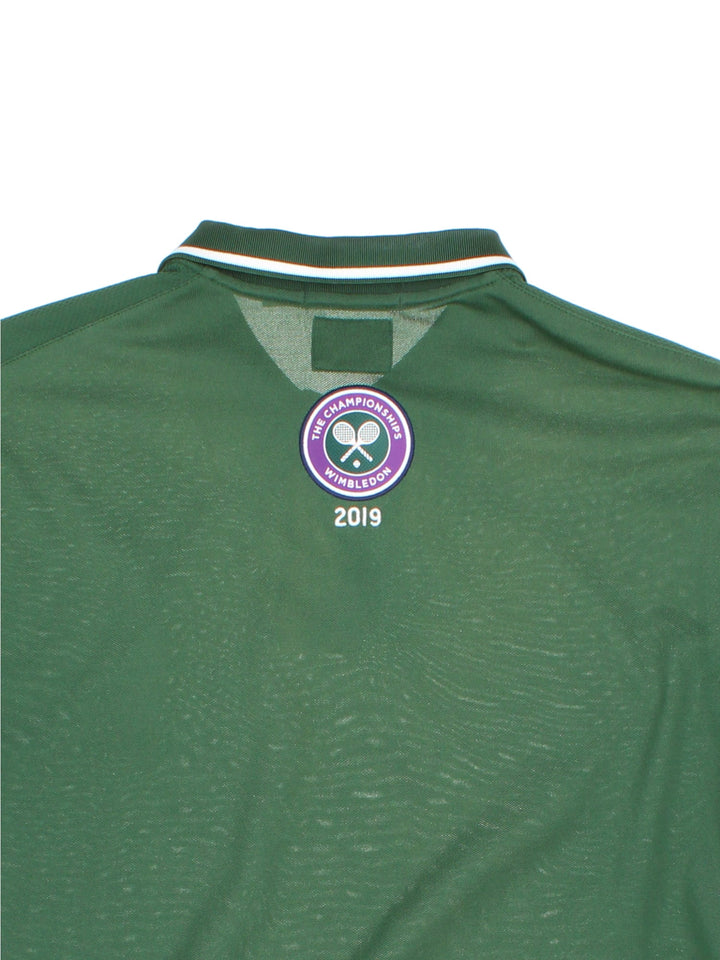 2019 Ralph Lauren Wimbledon Championship Polo Shirt in a green colourway with navy blue panels down the sides, and has the logo embroidered on the front and back.