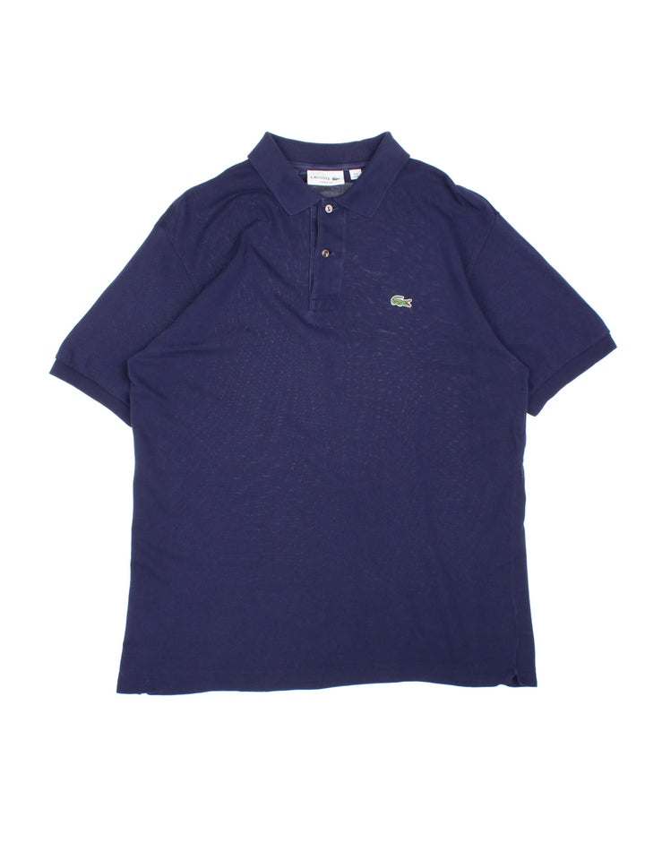 Lacoste Polo Shirt in a blue colourway with the logo embroidered on the front.