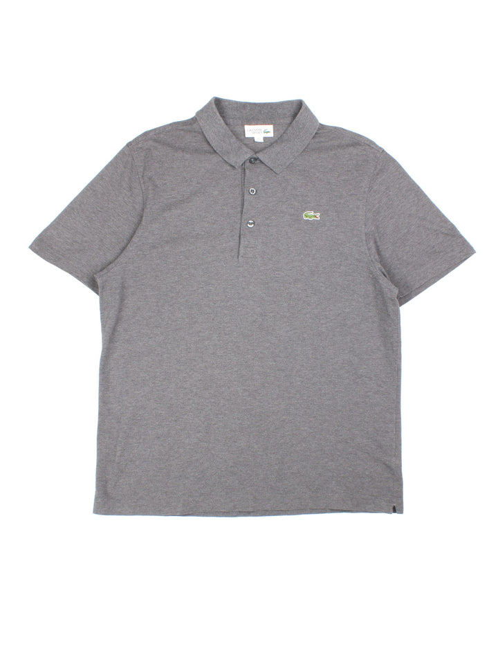 Lacoste Polo Shirt in a grey colourway with the logo embroidered on the front.