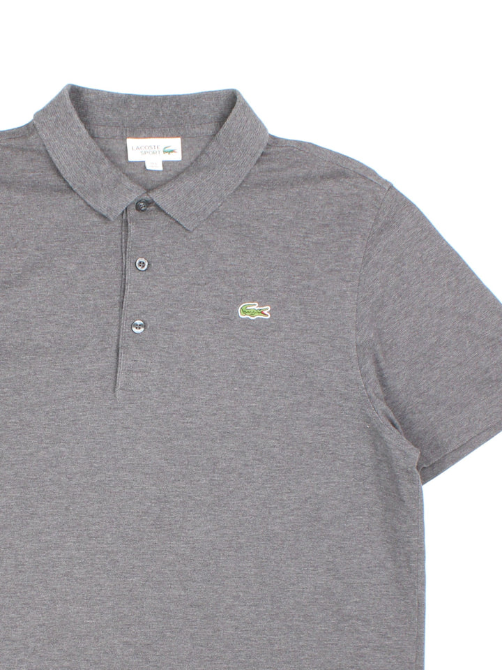 Lacoste Polo Shirt in a grey colourway with the logo embroidered on the front.