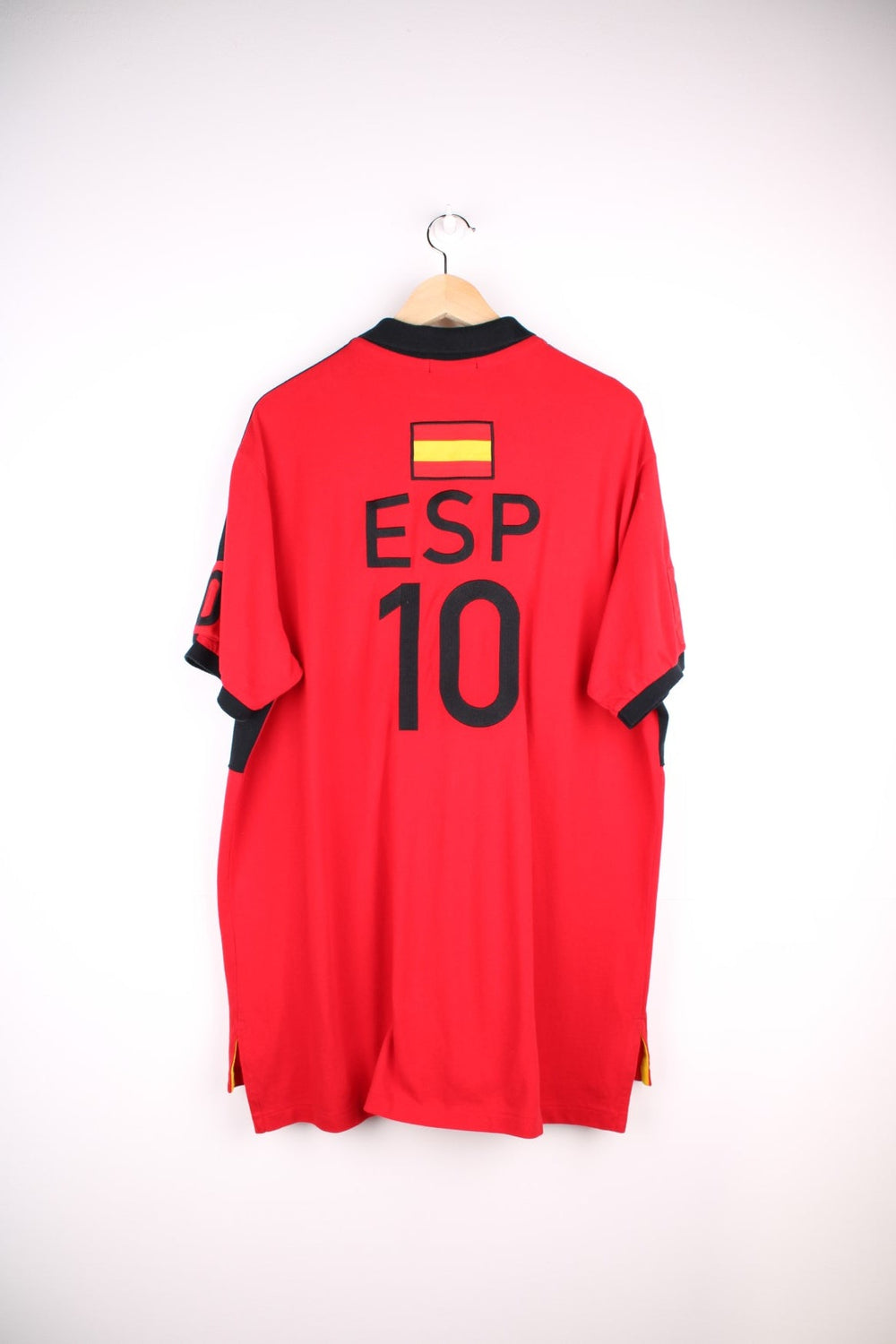 Ralph Lauren Spain polo shirt in a red colourway with black detail. Ralph Lauren logo and Spain graphic printed on front.