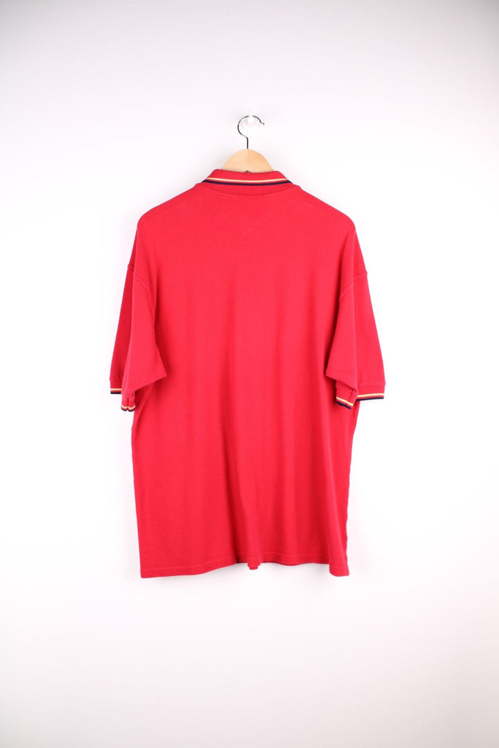 Fred Perry polo shirt in a red colourway with Fred Perry logo embroidered on front.