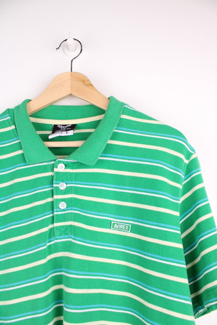 Avirex polo shirt in a striped green colourway with the logo on front.