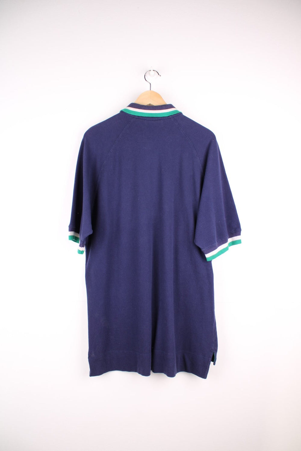 Adidas polo shirt in a navy colourway with striped collar detail and Adidas logo on the front.