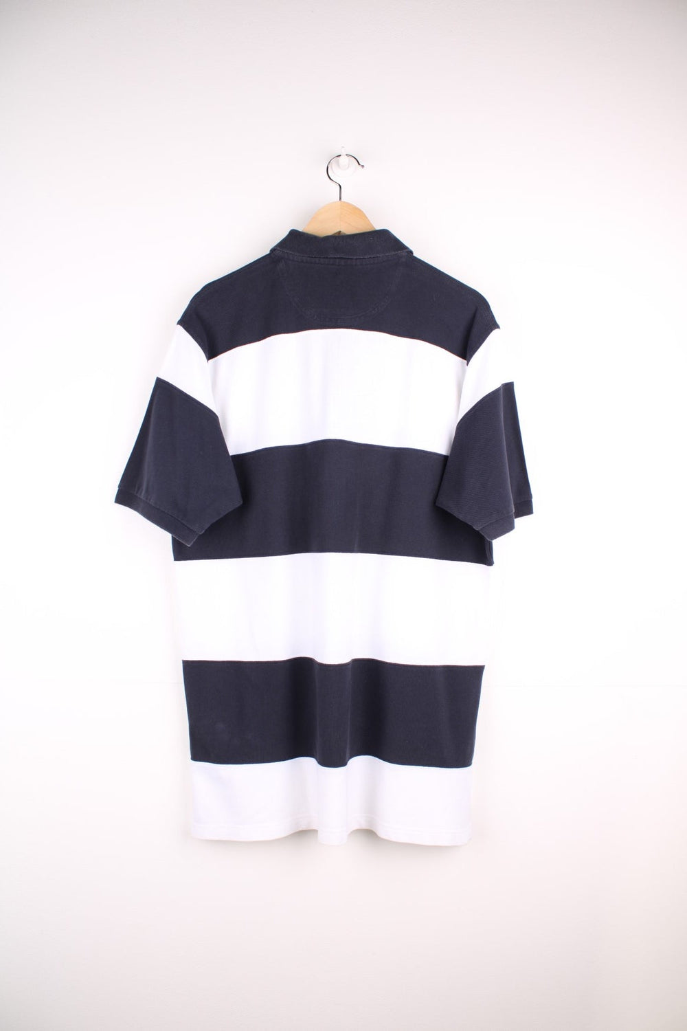 Fred Perry polo shirt in black and white stripe with Fred Perry on the front.