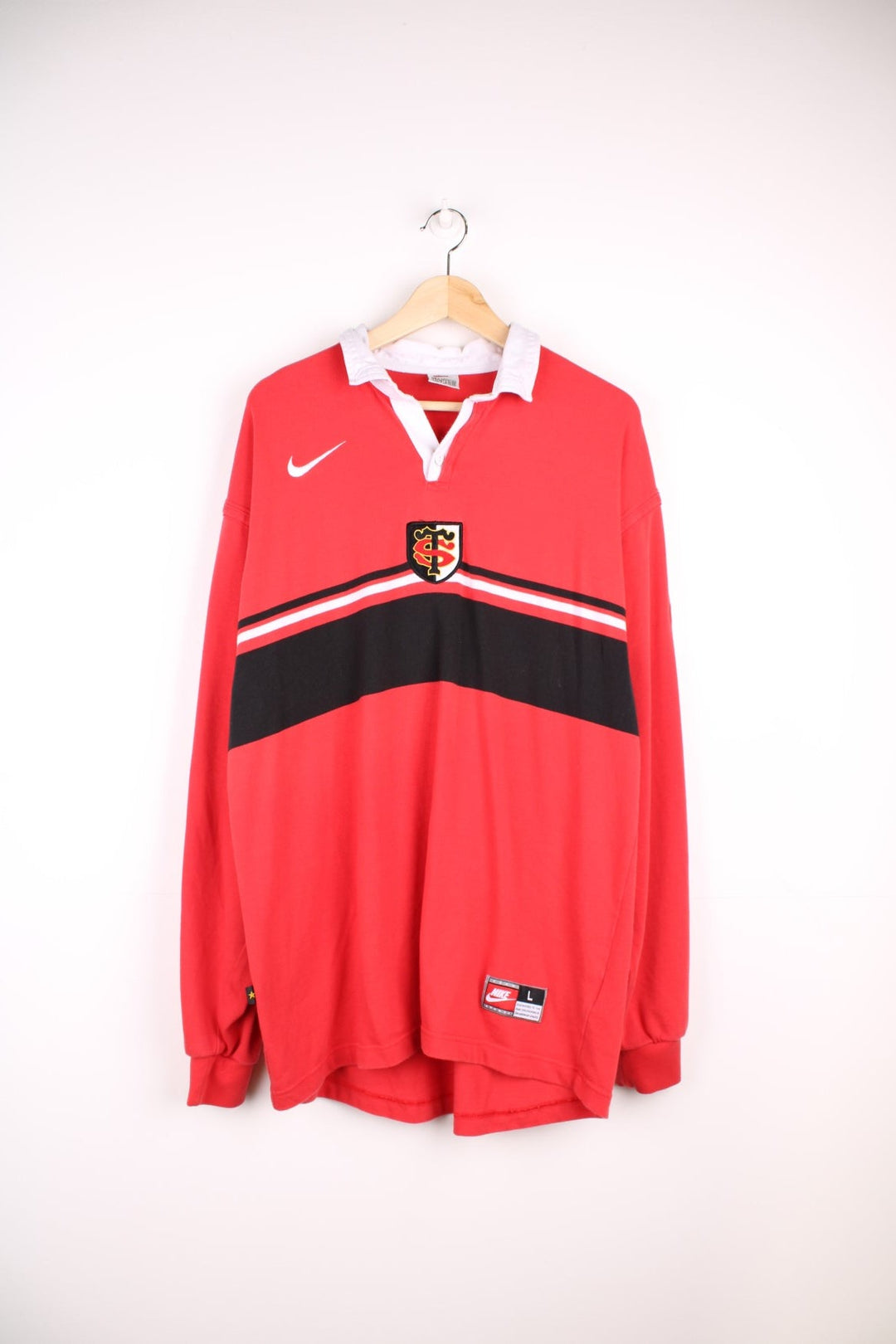 Stade Toulousain, Nike, long sleeved Rugby shirt in a red colourway with the team and Nike logos on the front. Rare shirt from the season when the club won the French Championship beating Montferrand 15-11 in the Final, reaching the Quarter Final of the Heineken Cup losing to Ulster.