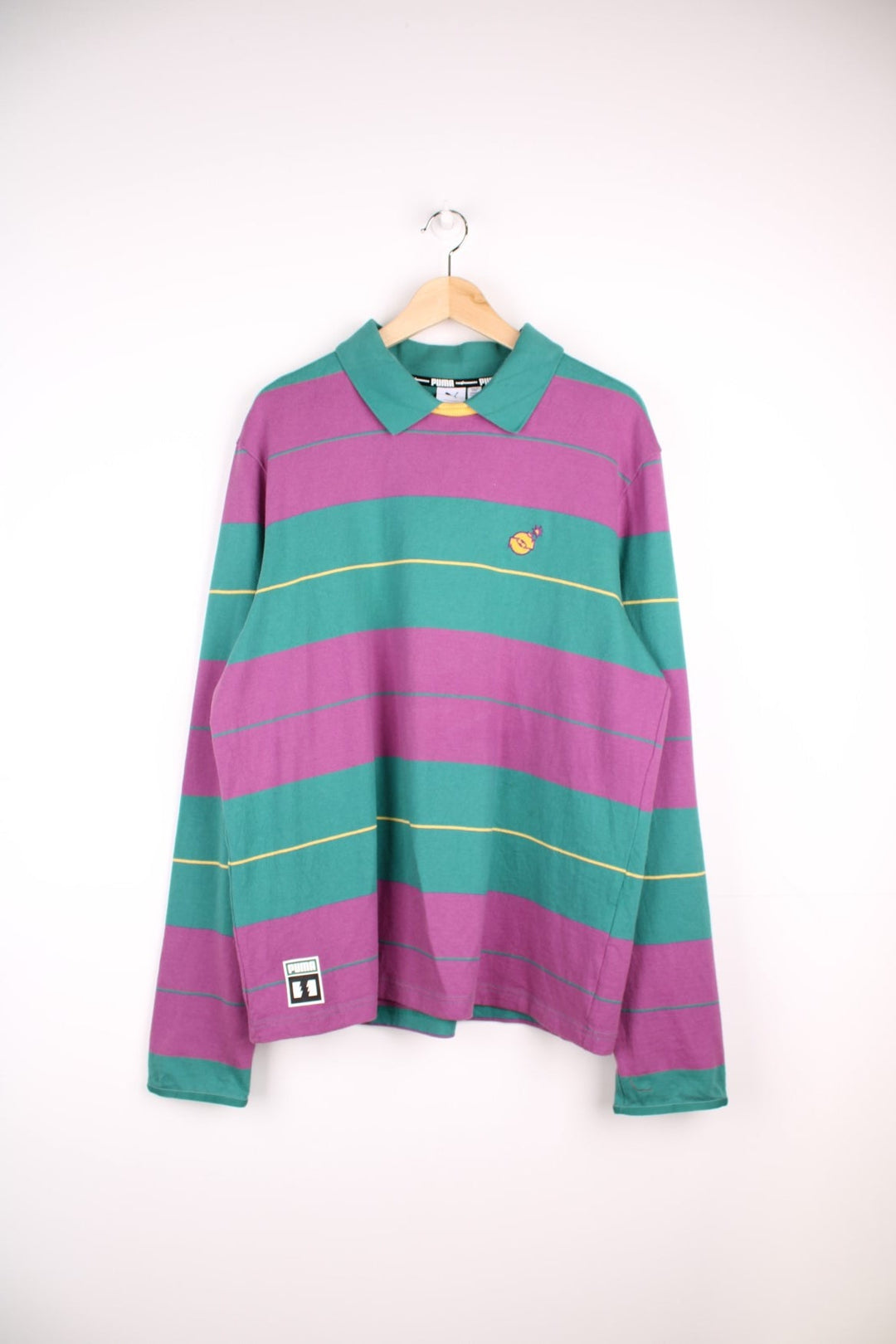 Puma x The Hundreds ltd. edition long sleeved rugby polo shirt with purple, yellow and green stripes. Embroidered logo on chest and puma logo on bottom hem.