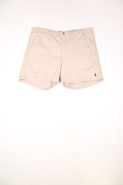 Ralph Lauren Pleated Cotton Shorts in a tanned colourway, has an adjustable waist, pockets and the logo embroidered on the front and back.