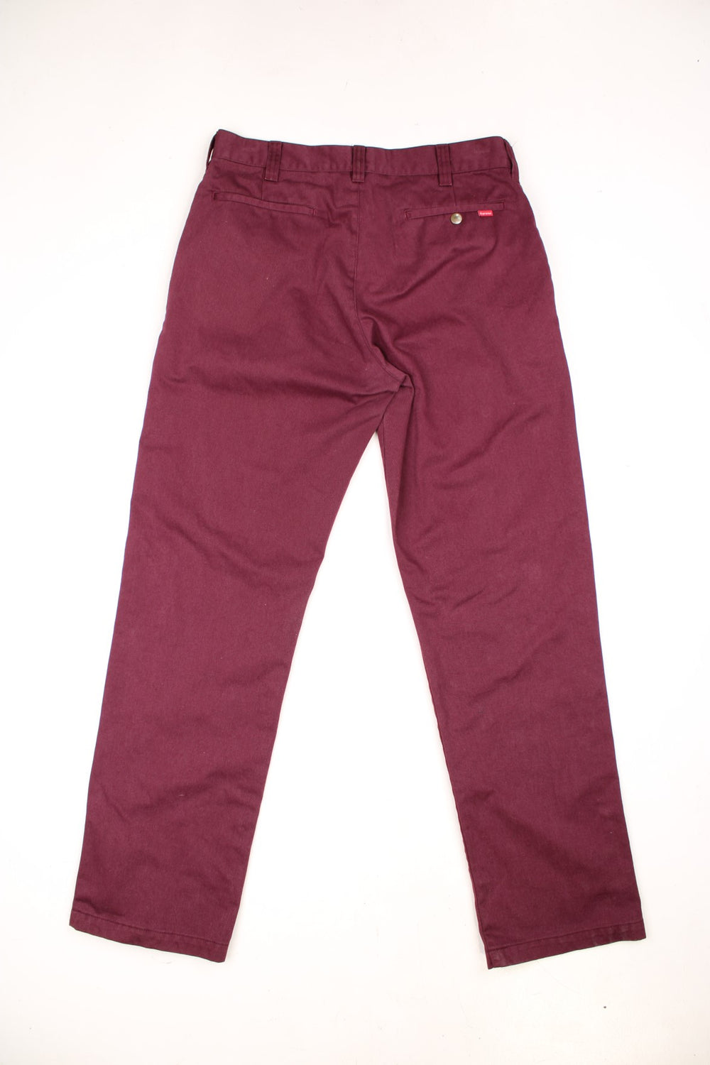 Supreme FW18 Work Pants in a burgundy colourway, plain with the logo embroidered on the back pocket.