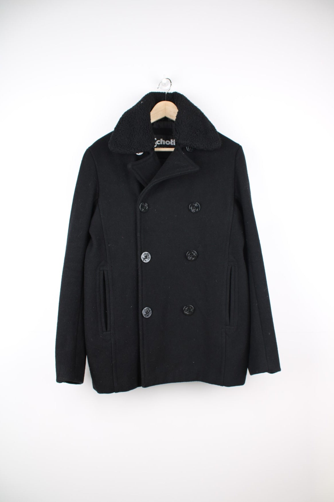 Schott N.Y.C Peacoat in a black colourway, button up with a big collar that has a detachable sherpa option.