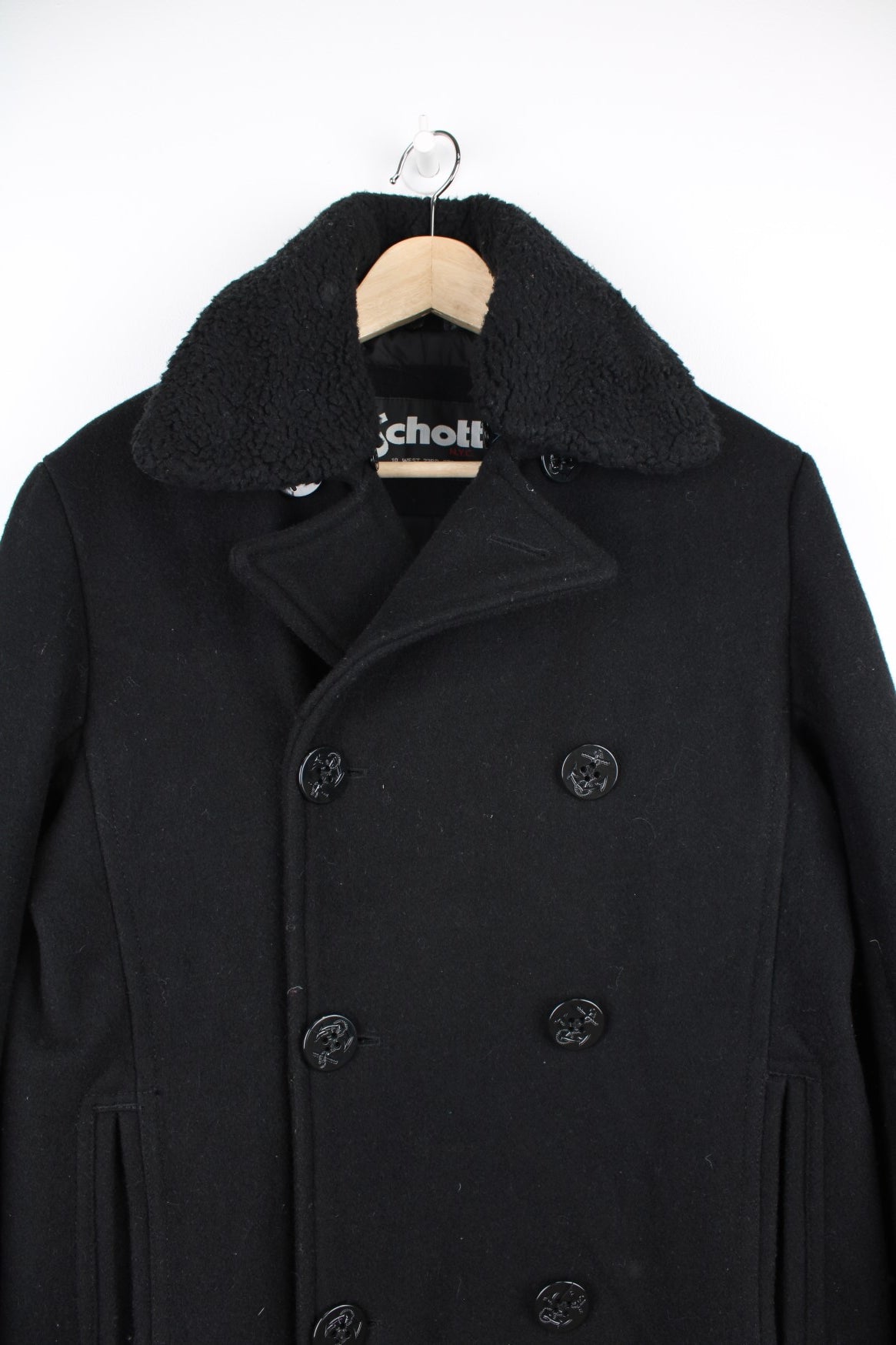 Schott N.Y.C Peacoat in a black colourway, button up with a big collar that has a detachable sherpa option.