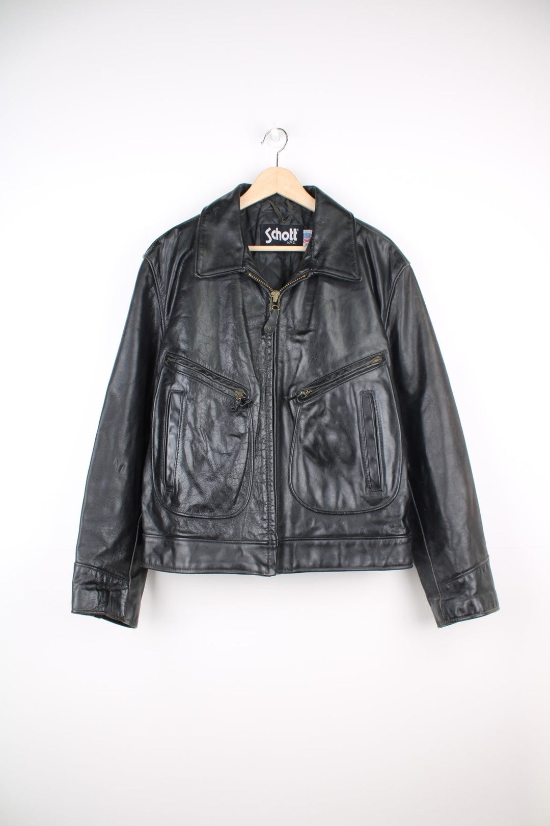 Vintage Schott N.Y.C Leather Bomber Jacket in a black colourway, zip up with multiple pockets and has a quilted lining. 