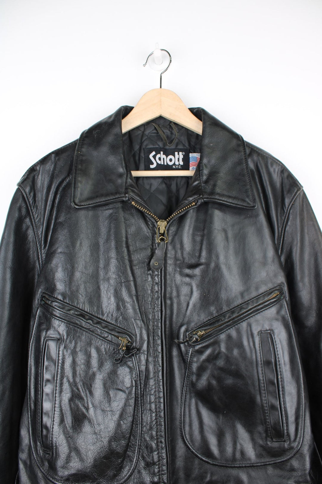 Vintage Schott N.Y.C Leather Bomber Jacket in a black colourway, zip up with multiple pockets and has a quilted lining. 