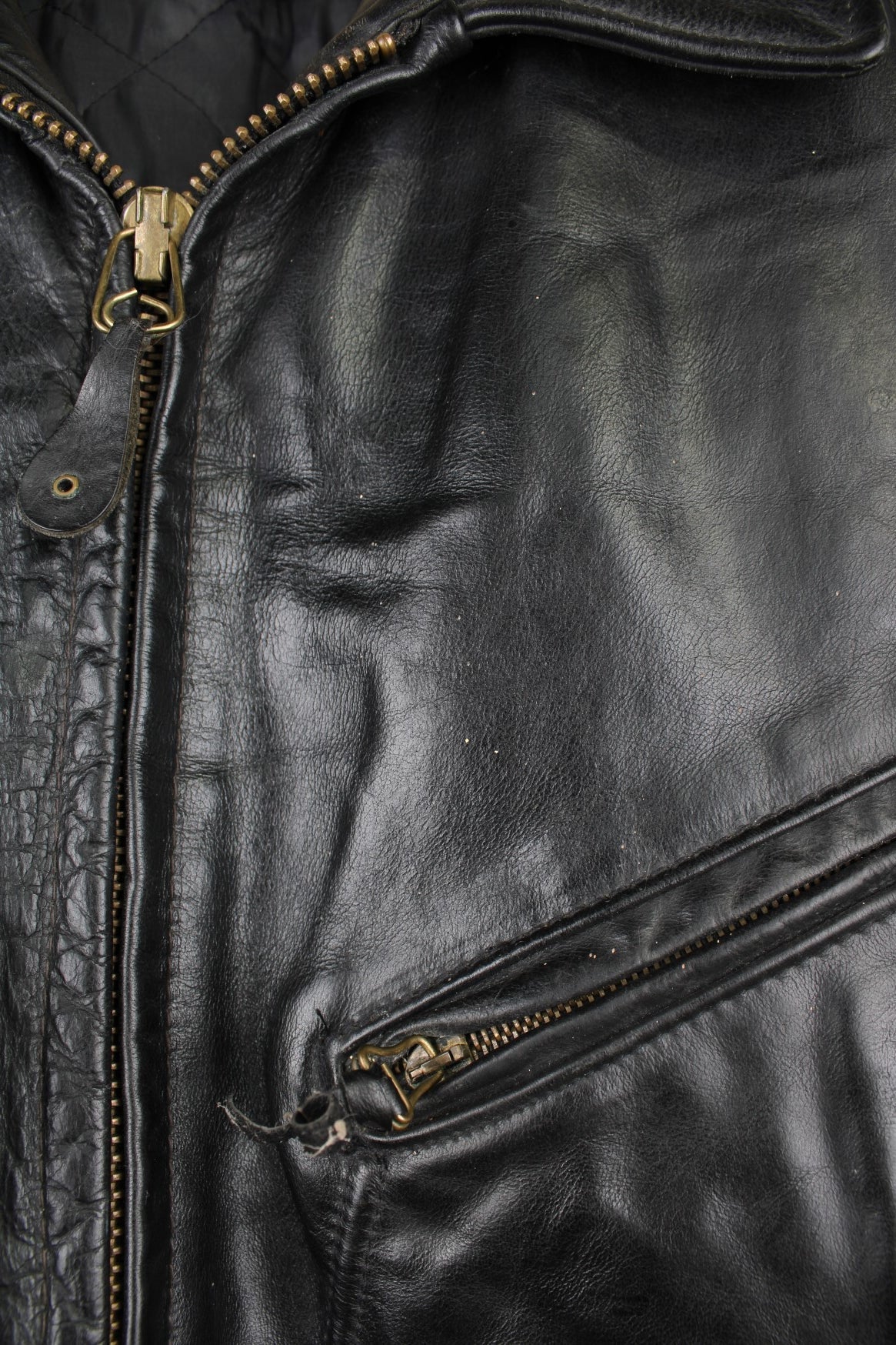 Vintage Schott N.Y.C Leather Bomber Jacket in a black colourway, zip up with multiple pockets and has a quilted lining. 