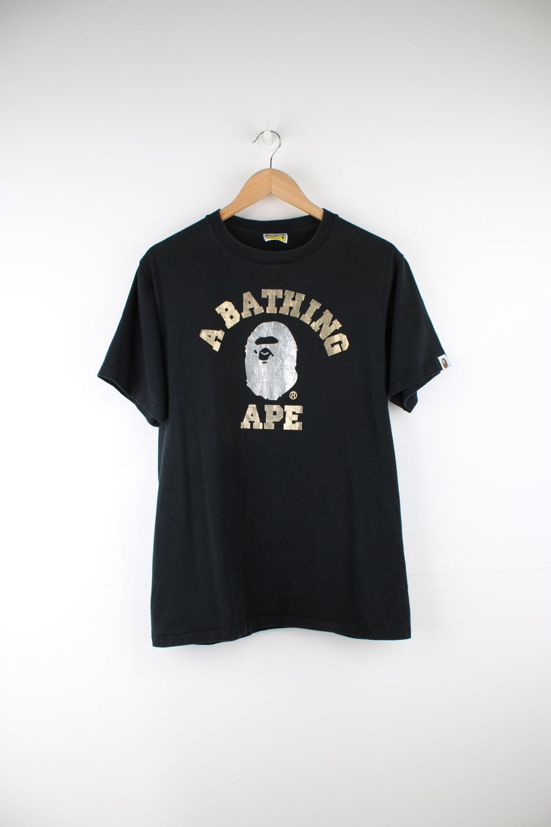 A Bathing Ape black graphic single stich t-shirt with spell-out metallic motif on the front