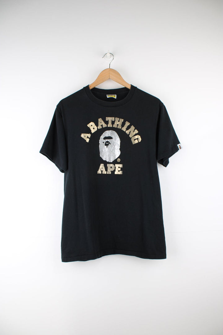 A Bathing Ape black graphic single stich t-shirt with spell-out metallic motif on the front