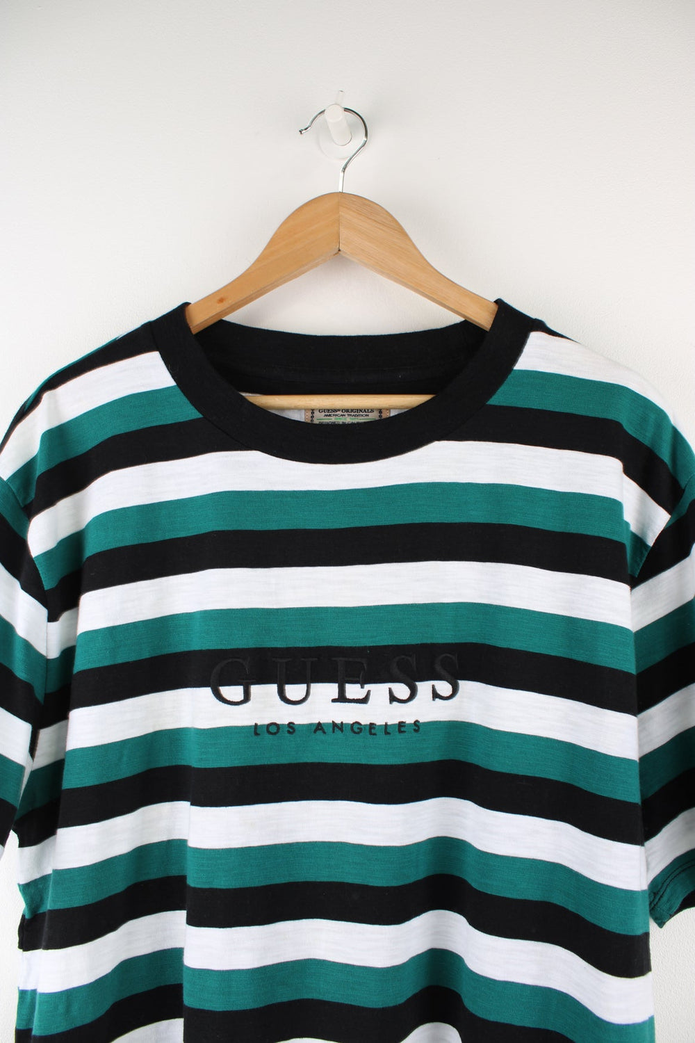 Guess green and black striped t-shirt with embroidered spell-out logo on the chest