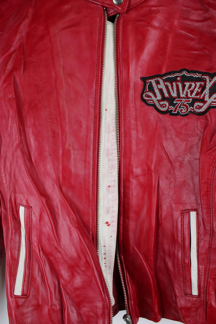 Vintage red leather Avirex zip through motorcycle jacket with white detailing and embroidered badges on the front/back.