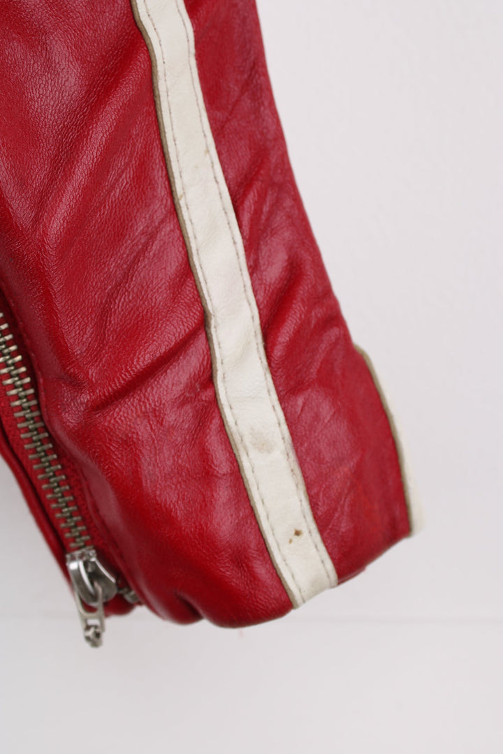 Vintage red leather Avirex zip through motorcycle jacket with white detailing and embroidered badges on the front/back.