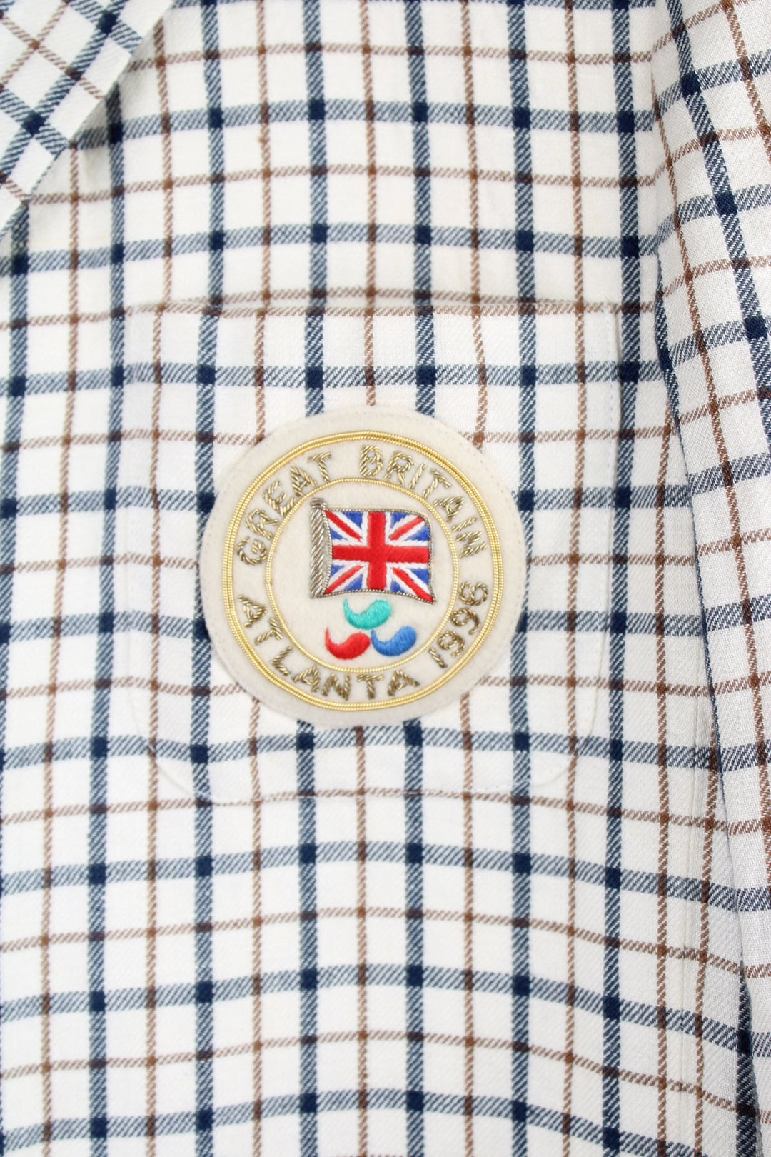 Vintage Aquascutum made in England linen blazer in a cream plaid pattern, features embellished badge on the pocket and golden buttons