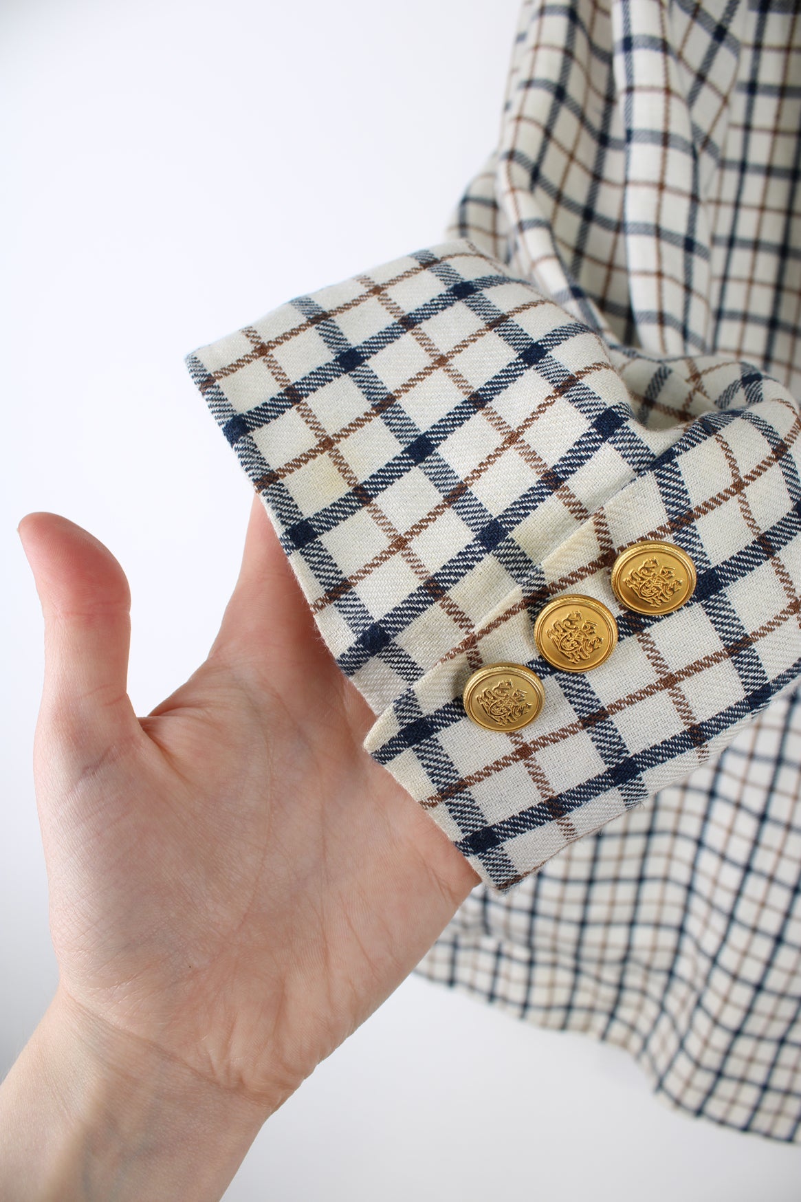 Vintage Aquascutum made in England linen blazer in a cream plaid pattern, features embellished badge on the pocket and golden buttons