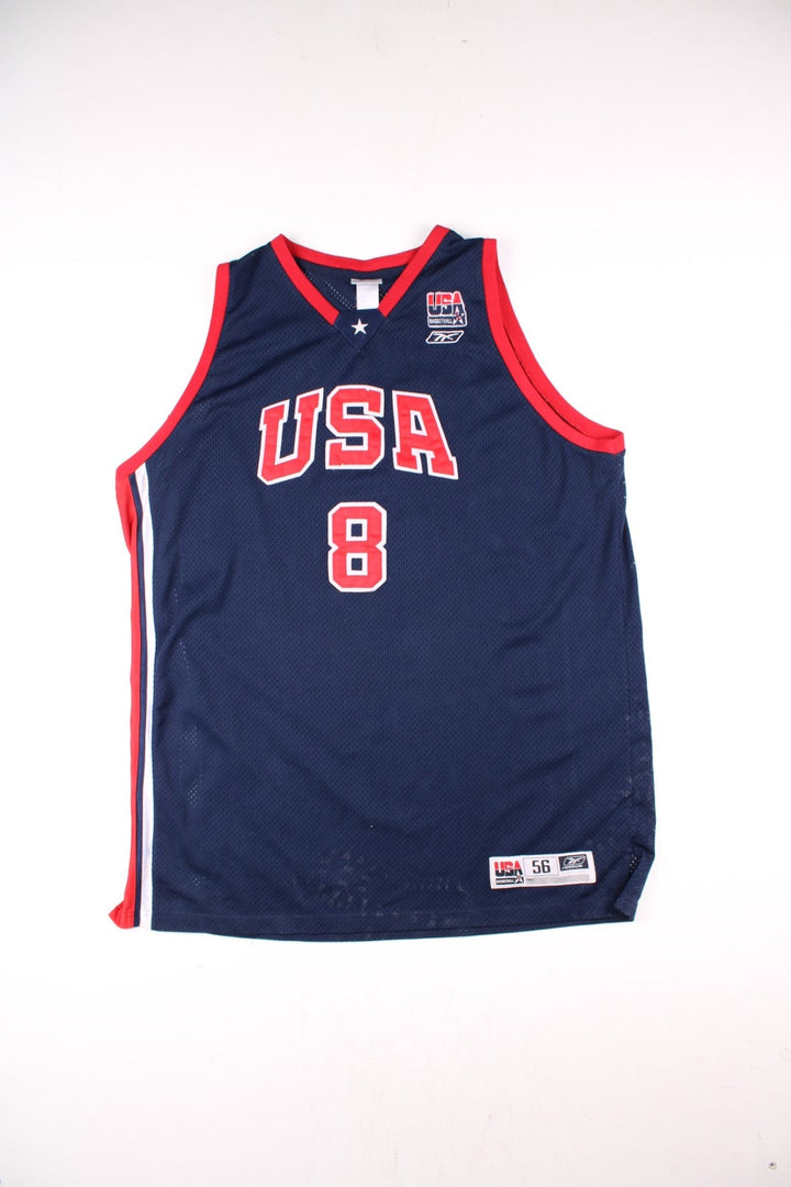 Vintage USA Dream Team Kobe Bryant Nike Basketball Jersey in a navy blue kit colourway, features embroidered logos and badge on the front, and on the back Bryant number 8.