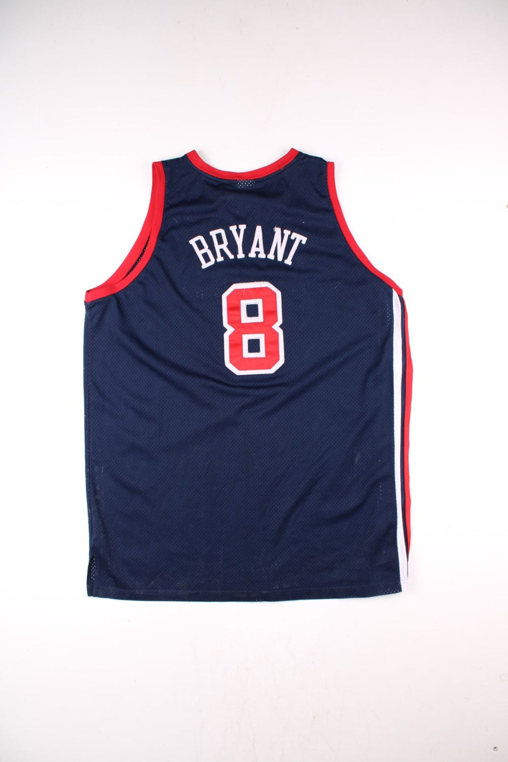 Vintage USA Dream Team Kobe Bryant Nike Basketball Jersey in a navy blue kit colourway, features embroidered logos and badge on the front, and on the back Bryant number 8.