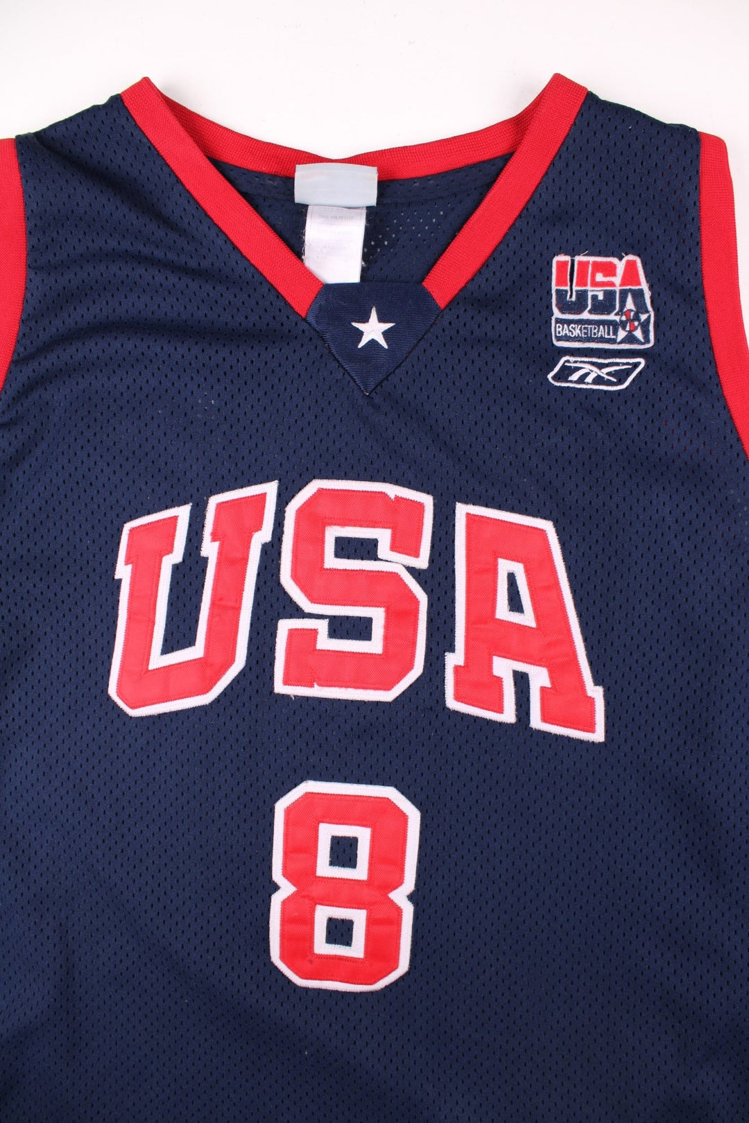 Vintage USA Dream Team Kobe Bryant Nike Basketball Jersey in a navy blue kit colourway, features embroidered logos and badge on the front, and on the back Bryant number 8.