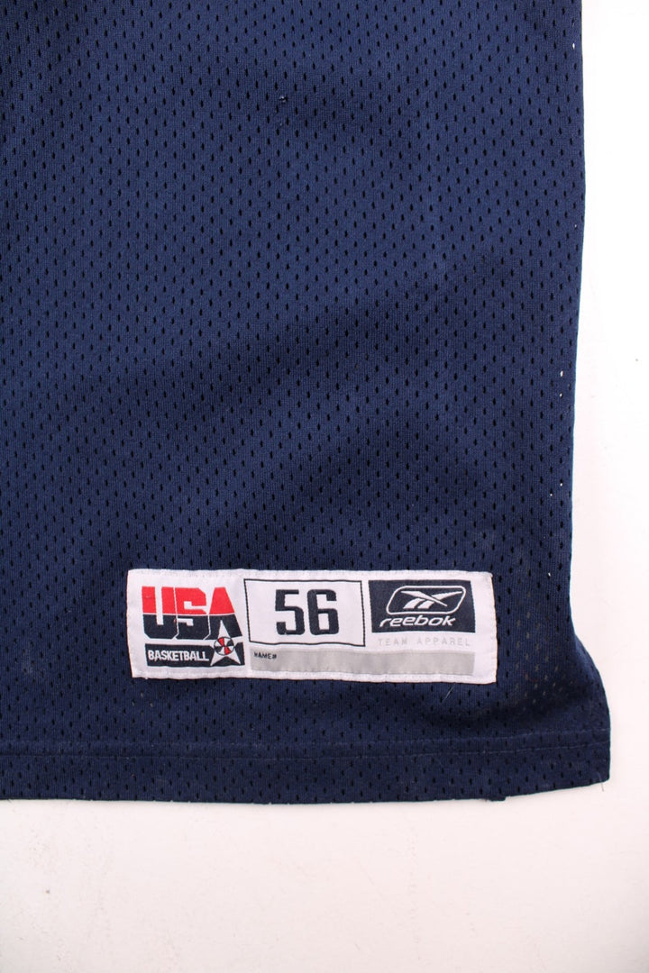 Vintage USA Dream Team Kobe Bryant Nike Basketball Jersey in a navy blue kit colourway, features embroidered logos and badge on the front, and on the back Bryant number 8.