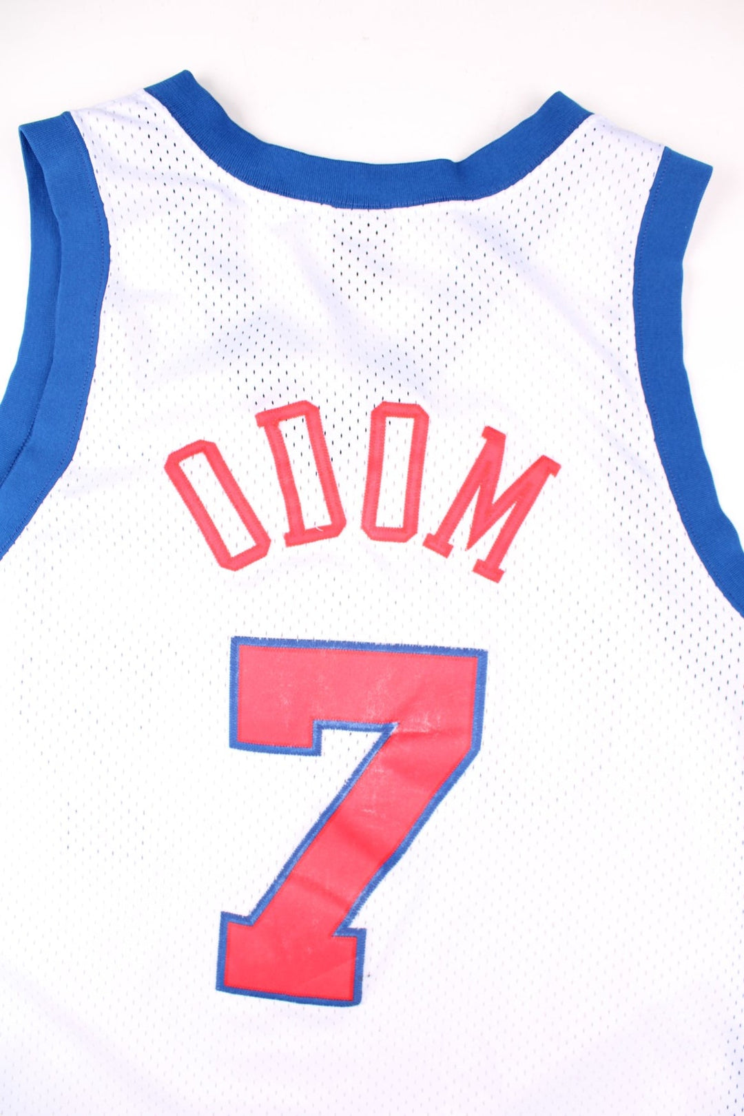 LA Clippers Lamar Odom NBA Basketball Jersey in the white, blue and red kit colourway, features embroidered logos and badge on the front, and Lamar Odom number 7 on the back.