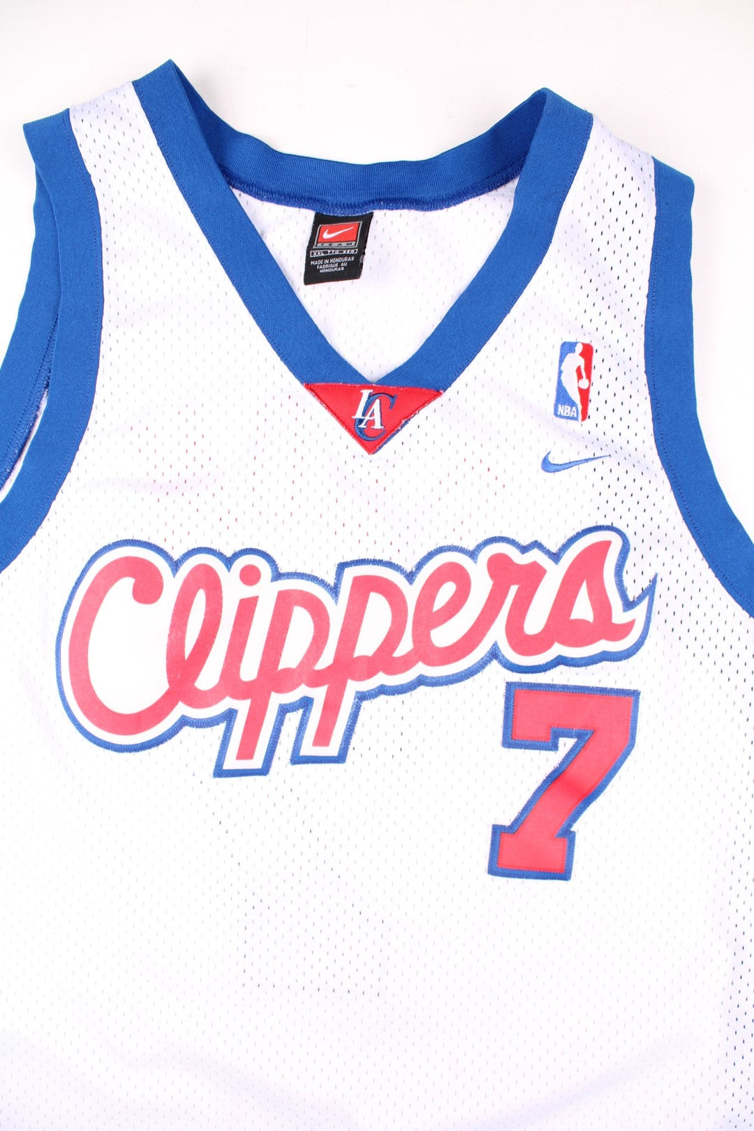 LA Clippers Lamar Odom NBA Basketball Jersey in the white, blue and red kit colourway, features embroidered logos and badge on the front, and Lamar Odom number 7 on the back.