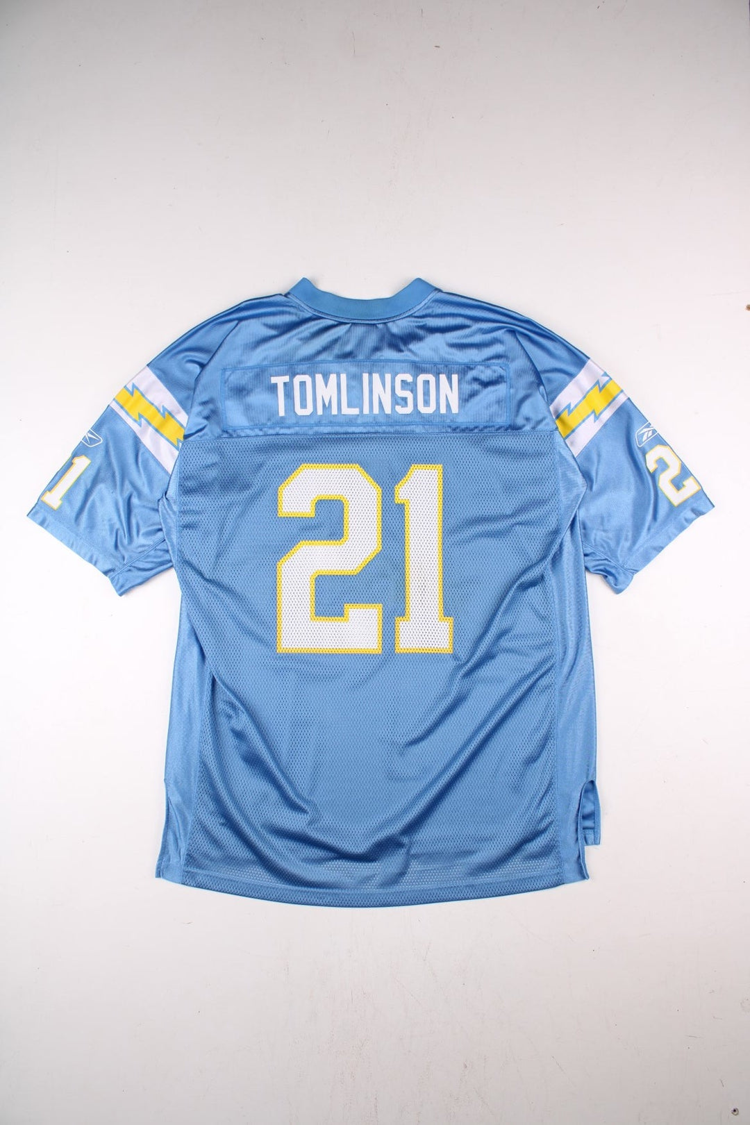 San Diego Chargers NFL LaDainian Tomlinson Jersey in the blue kit colourway, feature logos and badge on the front, and Tomlinson number 21 on the back.