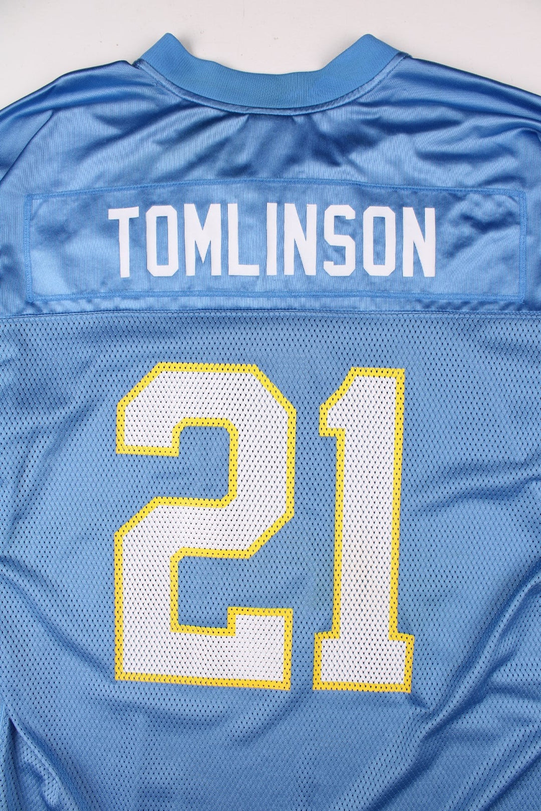 San Diego Chargers NFL LaDainian Tomlinson Jersey in the blue kit colourway, feature logos and badge on the front, and Tomlinson number 21 on the back.