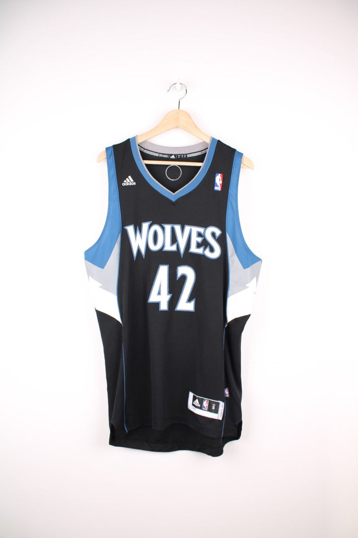 NBA Minnesota Wolves Jersey in a black, blue and white colourway, Kevin Love number 42 on the back, and has the logos embroiderd on the front. 