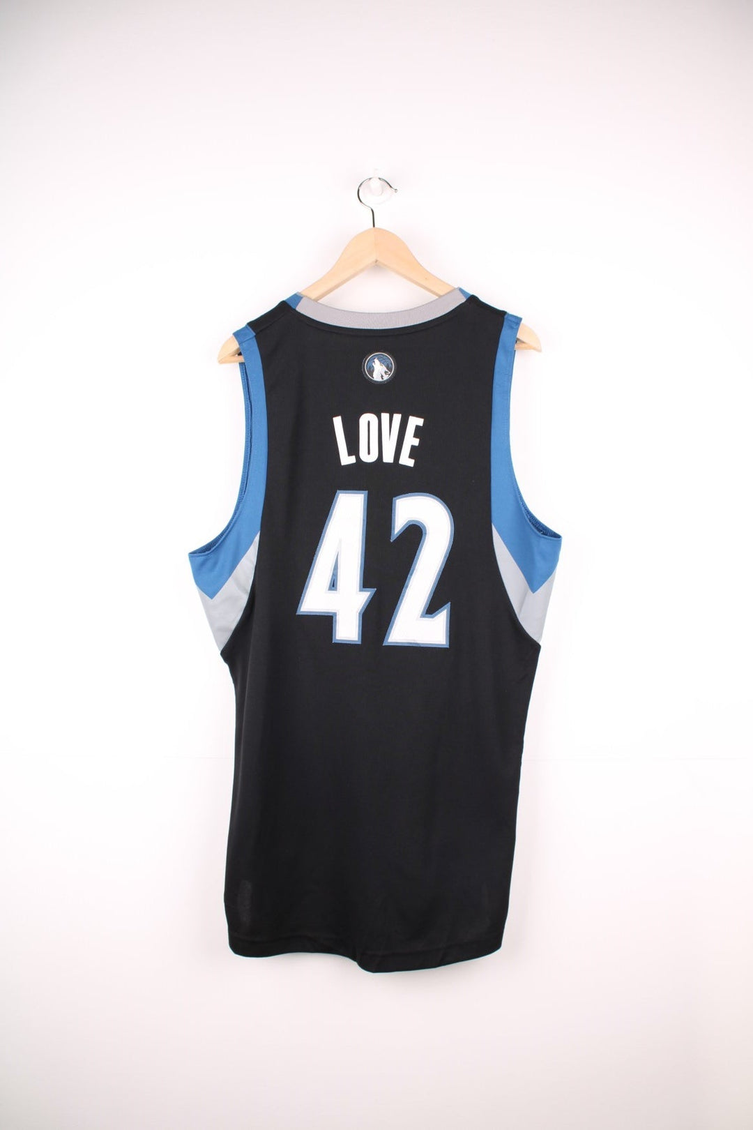 NBA Minnesota Wolves Jersey in a black, blue and white colourway, Kevin Love number 42 on the back, and has the logos embroiderd on the front. 