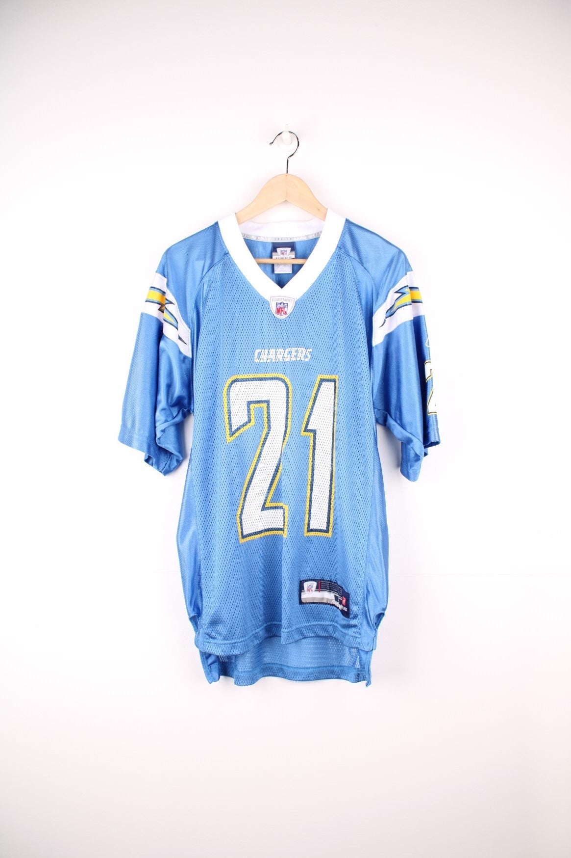 San Diego Chargers NFL Jersey in the blue, white and yellow team colourway, LaDainian Tomlinson number 21 printed on the back, and the logos on the front. 