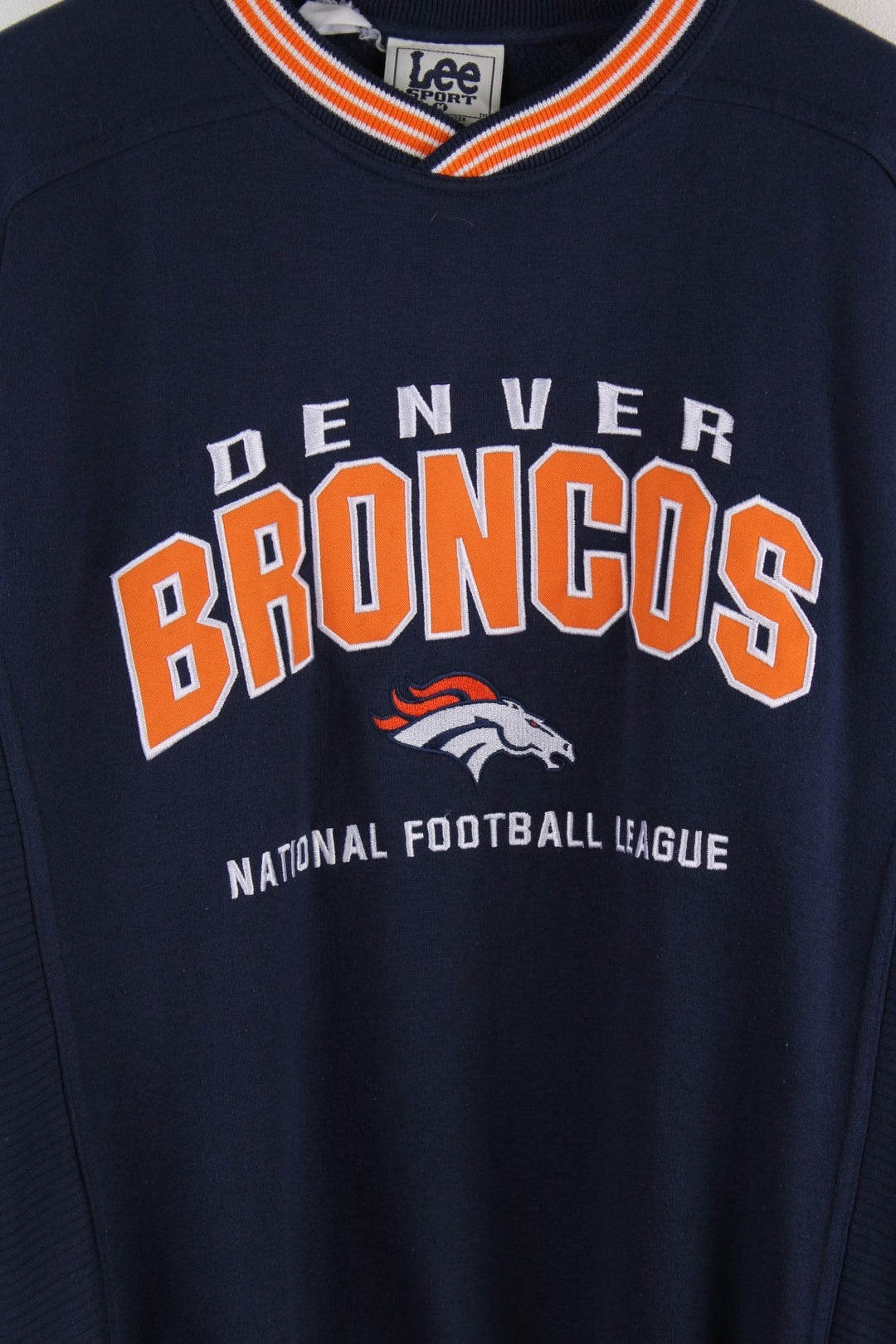 Lee Sport Denver Broncos NFL sweatshirt in navy blue with an orange and white spellout and small embroidered horse logo on the front.