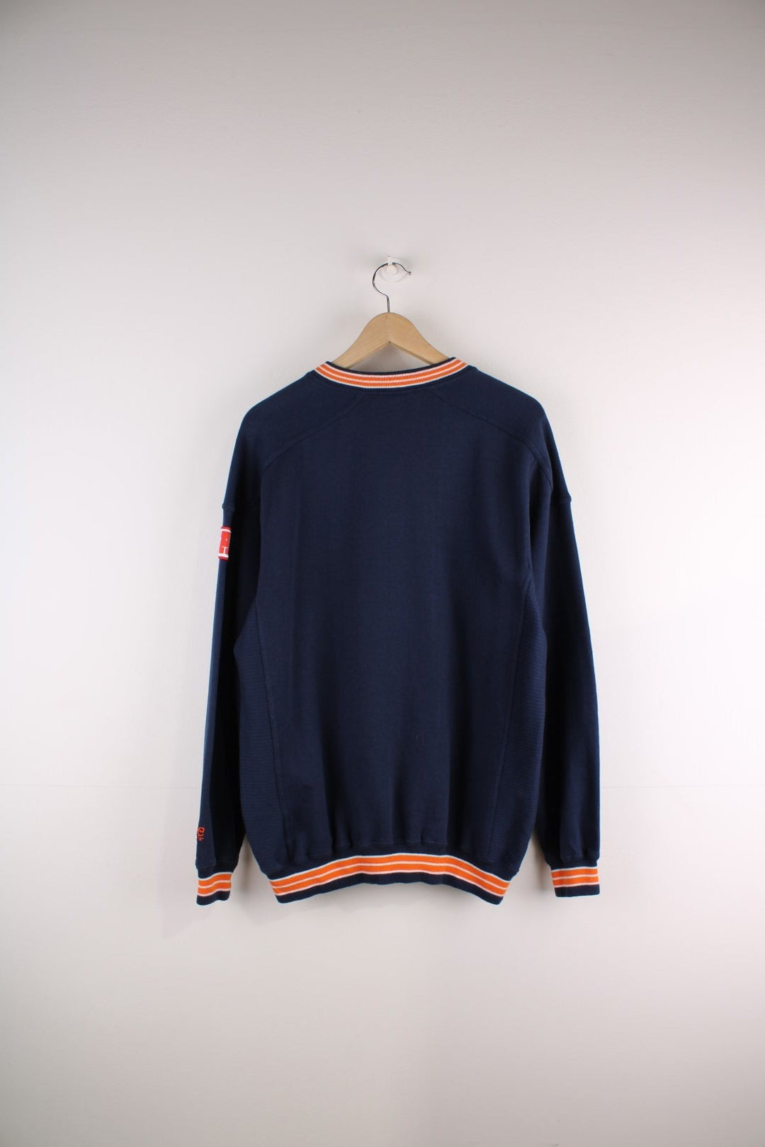 Lee Sport Denver Broncos NFL sweatshirt in navy blue with an orange and white spellout and small embroidered horse logo on the front.