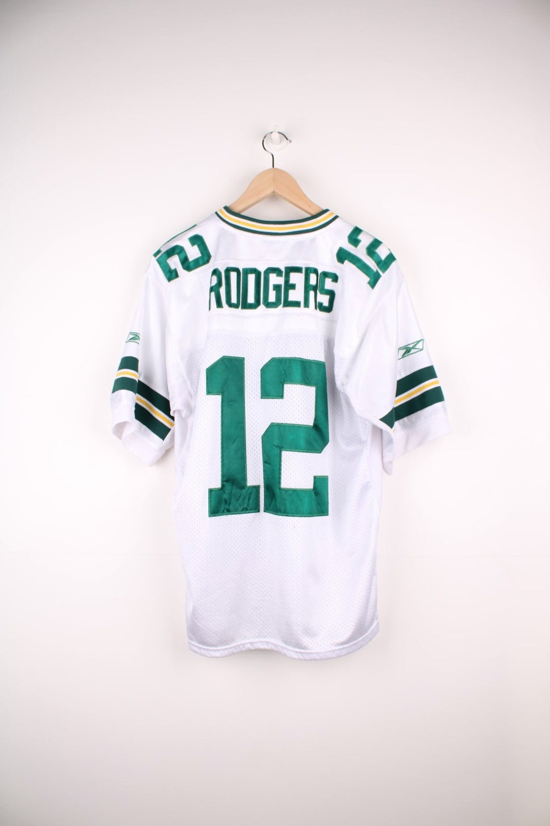 NFL Green Bay Packers Jersey in a white green and yellow colourway, Aaron Rodgers number 12 on the back, and the logos embroidered on the front. 