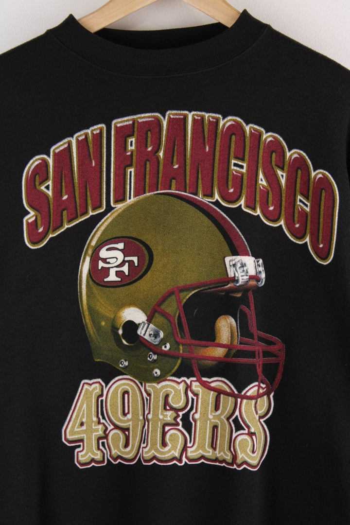 Vintage San Francisco 49ers in black with football helmet graphic and red and yellow spellout on the front.