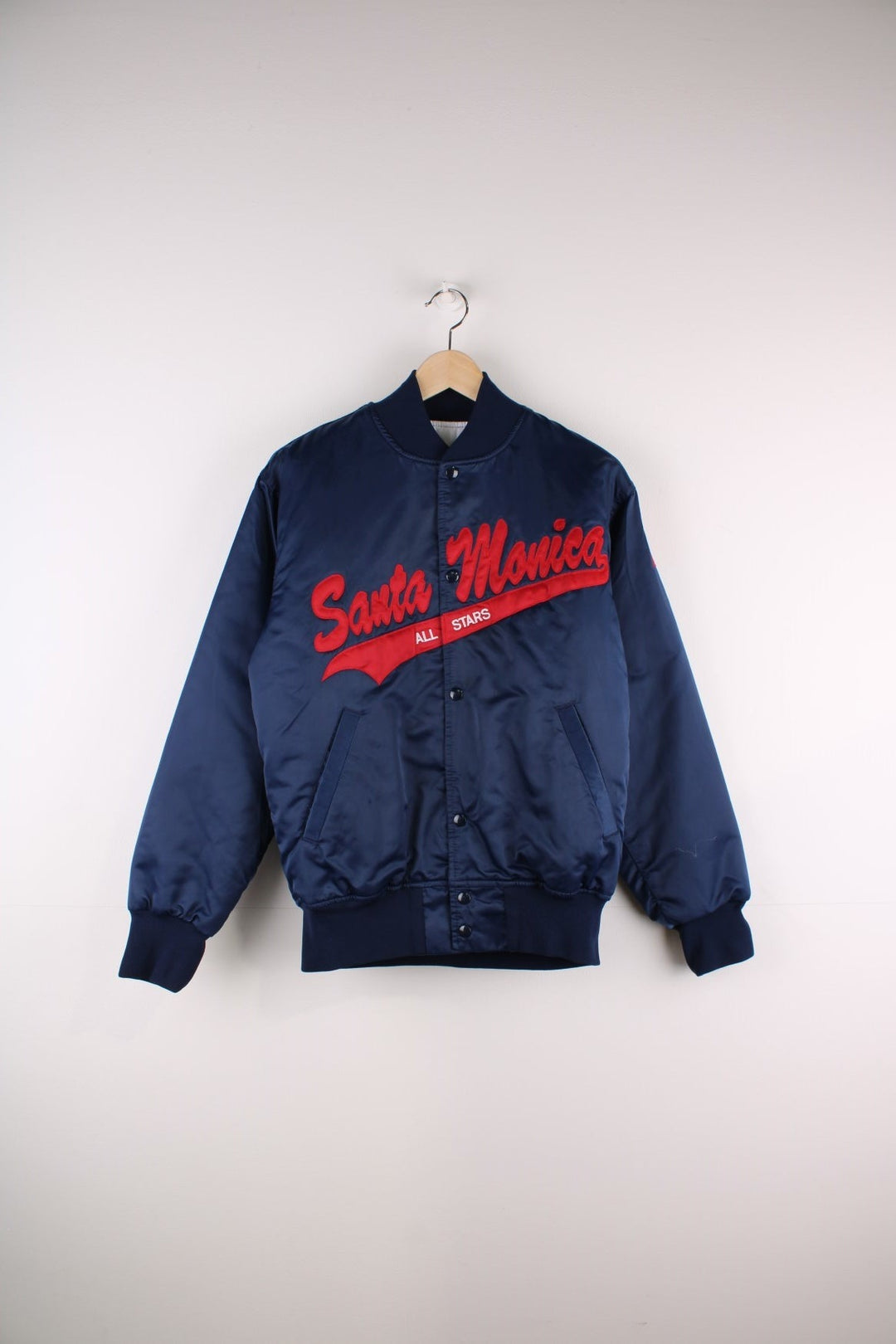 Vintage Santa Monica All Stars bomber jacket in  navy blue with red script embroidery on the front and 'Rosenblum' over a red star on the back.