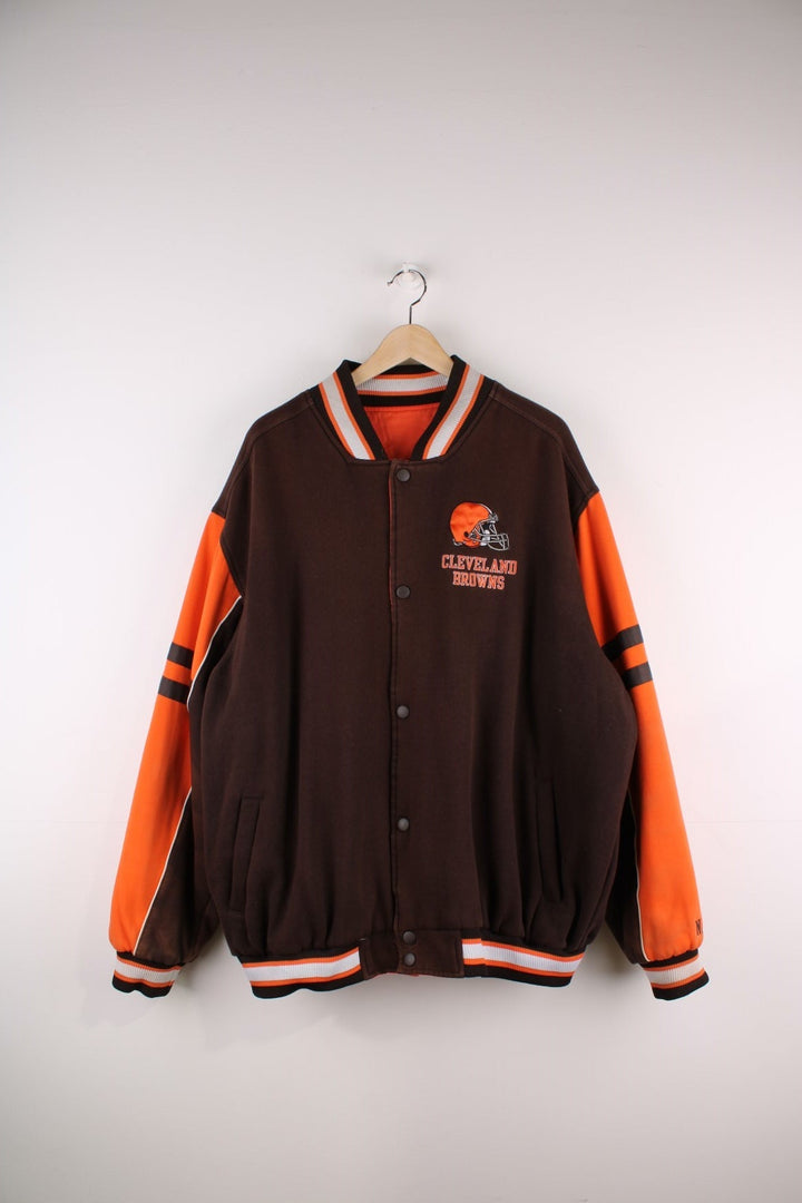 Cleveland Browns Reversible NFL varsity jacket in brown with orange sleeves and vice versa on the reverse side, with team logos and spellouts on the chest, back and sleeves of both sides.