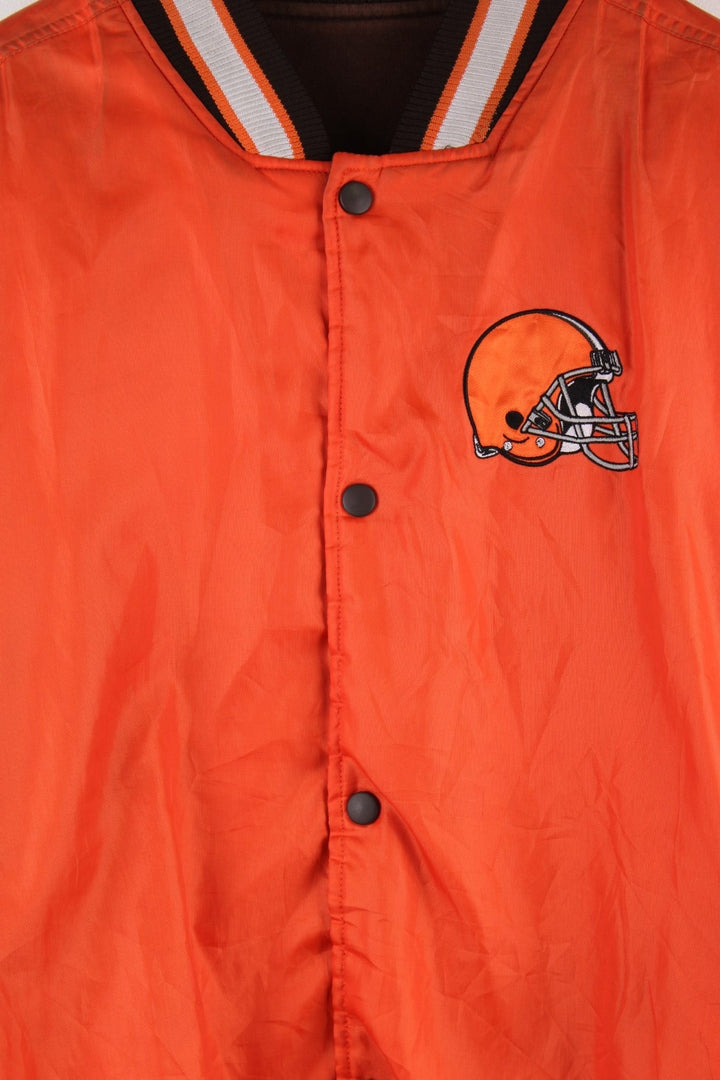 Cleveland Browns Reversible NFL varsity jacket in brown with orange sleeves and vice versa on the reverse side, with team logos and spellouts on the chest, back and sleeves of both sides.