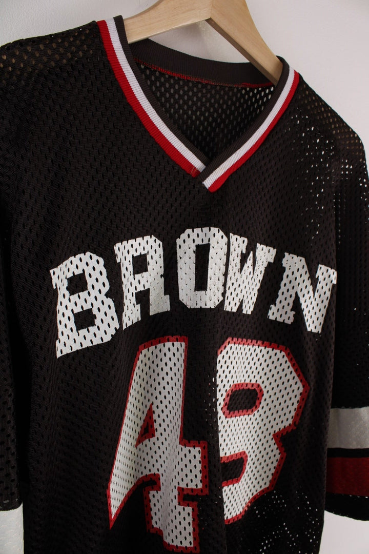 Champion Brown University #48 jersey in brown with red and white stripe detailing and an embroidered Champion patch on the hem.