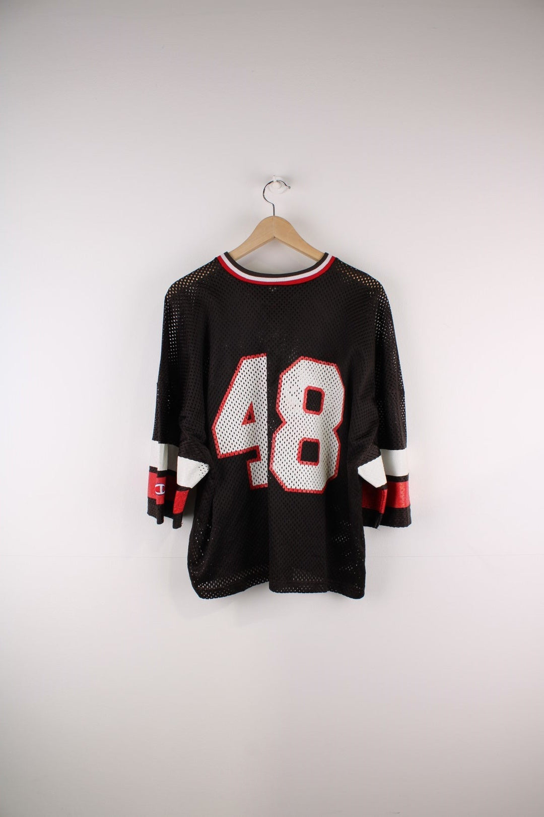 Champion Brown University #48 jersey in brown with red and white stripe detailing and an embroidered Champion patch on the hem.