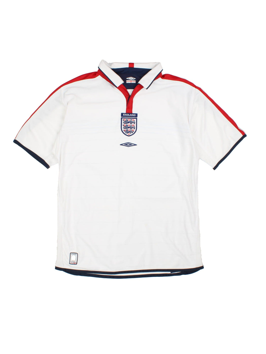 England 2003/05 Umbro home kit reversible football shirt in white with blue stripes and navy blue collar and piping on one side, red on the other. 2 snap closure at the neck, and a logo and badge on the front on both sides.