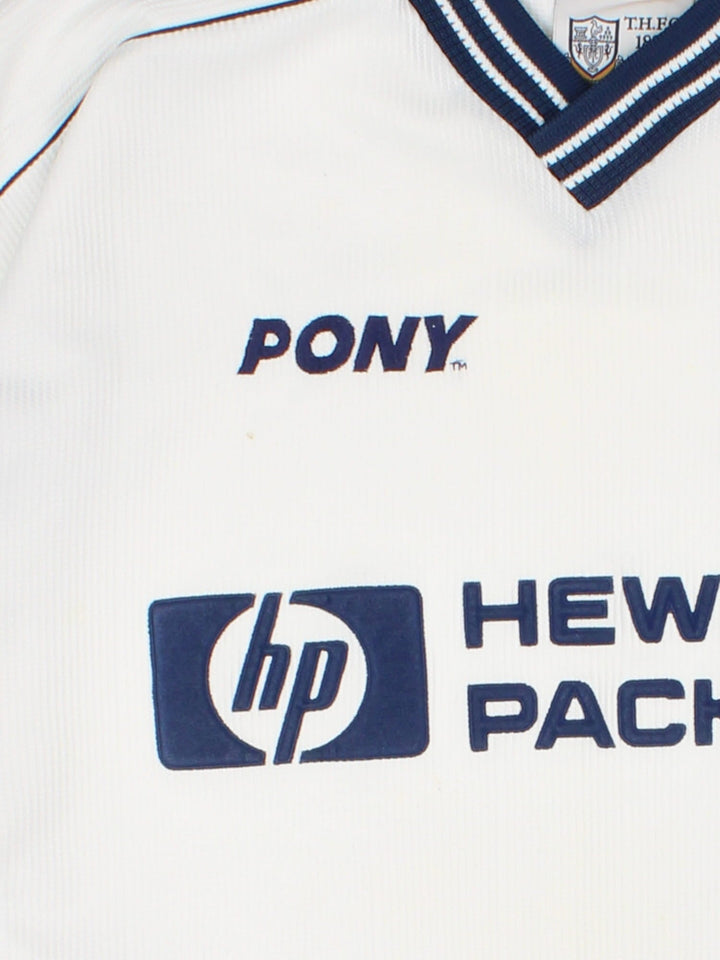 Tottenham 1997/99 Pony home kit football shirt in black with navy blue detailing at the collar and cuffs, logos embroidered on the front and the team motto on the back.