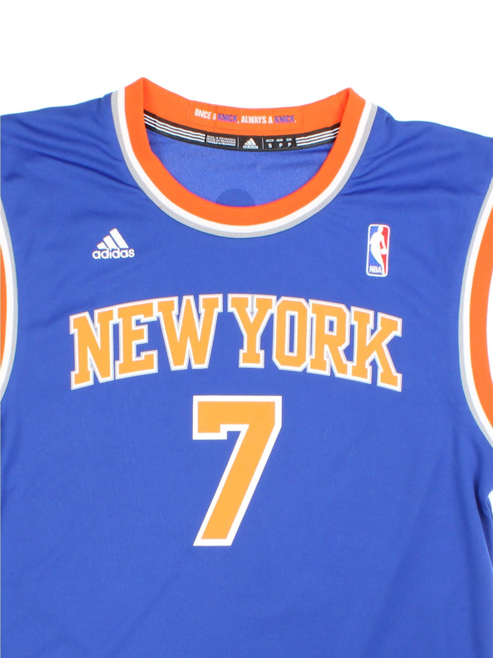 00s New York Knicks Adidas NBA jersey in blue with orange and white stripe detailing, embroidered logos on the front and Anthony no.7 on the back .