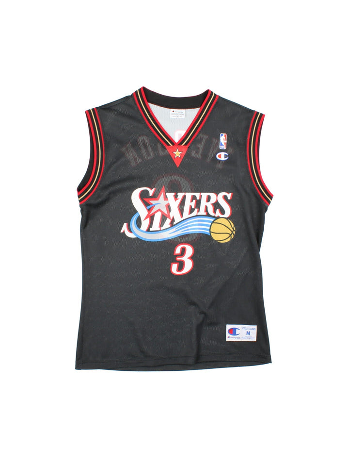 Philadelphia 76ers Champion NBA jersey in black with red and yellow stripe detail, printed and embroidered logos on the front, and no. 3 Iverson on the back.